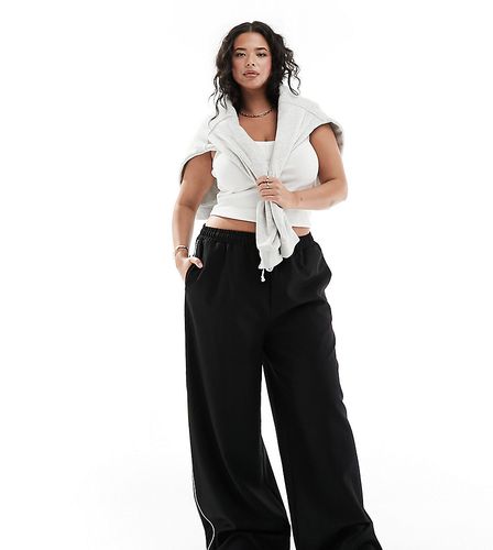 Pantalon large avec bande latérale et cordon de serrage contrastant à la taille - In The Style Plus - Modalova