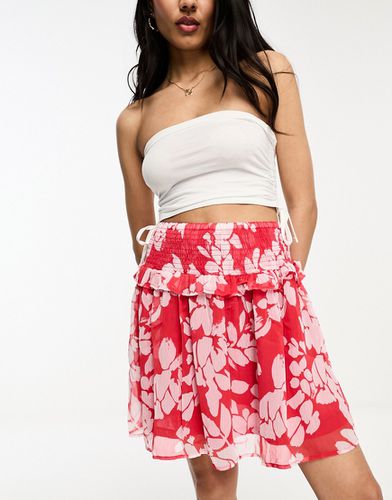Mini-jupe volantée à fleurs - et rose - Jdy - Modalova