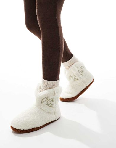 Chaussons duveteux style bottines de cowboy en imitation peau de mouton - Crme - Loungeable - Modalova