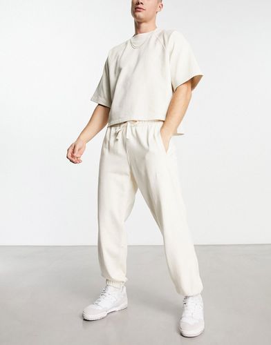 Pantalon de jogging avec logo - cassé délavé - New Balance - Modalova