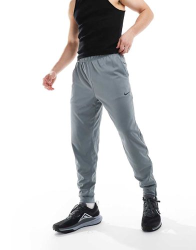 Totality - Pantalon de jogging en tissu Dri-FIT - foncé - Nike Training - Modalova