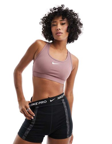 Brassière de sport à maintien intermédiaire en tissu Dri-FIT et logo virgule - Mauve cendré - Nike Training - Modalova