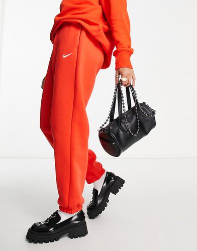 Nike - Pantalon de jogging large taille haute avec petit logo virgule -  Noir et voile