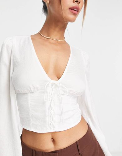 Blouse romantique style corset en satin - Stradivarius - Modalova