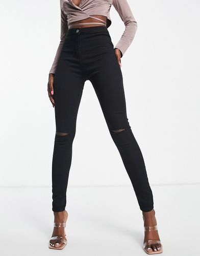 Jegging en jean stretch avec genoux déchirés - Rebellious Fashion - Modalova
