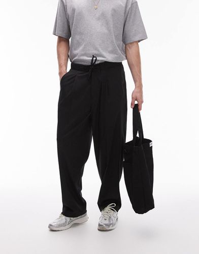 Pantalon de jogging baggy avec taille élastique à détail noué - Topman - Modalova