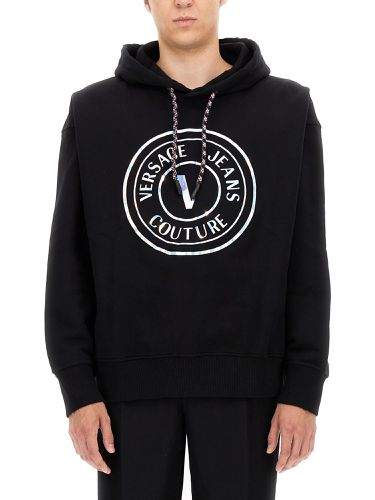 Sweatshirt with laminated logo - versace jeans couture - Modalova