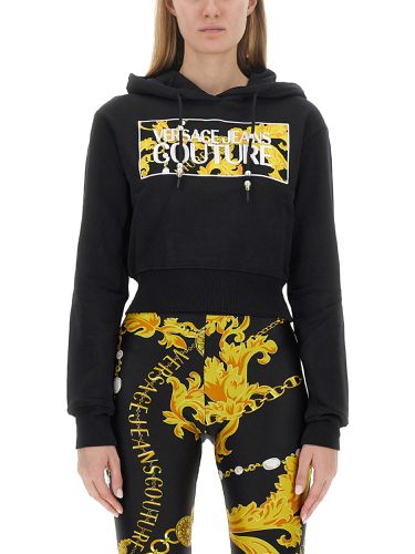 Cropped sweatshirt with logo - versace jeans couture - Modalova