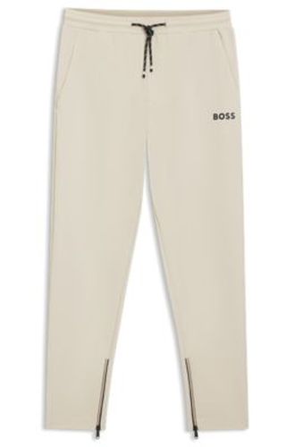 Active Bas de survêtement en gabardine stretch avec ourlets zippés - Boss - Modalova