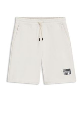 Short en molleton de coton avec logo écaille de tortue - HUGO - Modalova