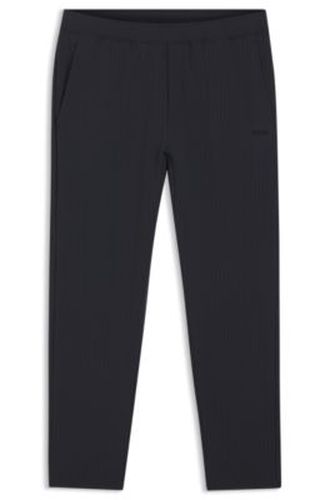 Pantalon en tissu stretch gaufré avec fermeture éclair encadrée et cordon de serrage - Boss - Modalova