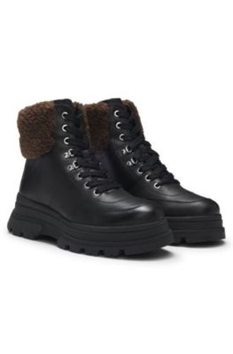 Bottines en cuir avec finitions en fourrure synthétique - Boss - Modalova