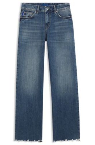 Jean Loose en denim à ourlets effilochés - HUGO - Modalova