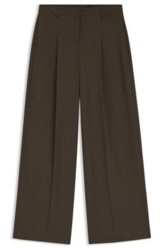 Pantalon large en tissu stretch plissé sur le devant - Boss - Modalova