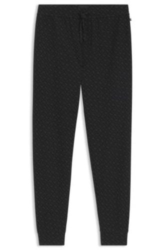 Bas de pyjama à bords-côtes en tissu gaufré à monogrammes - Boss - Modalova