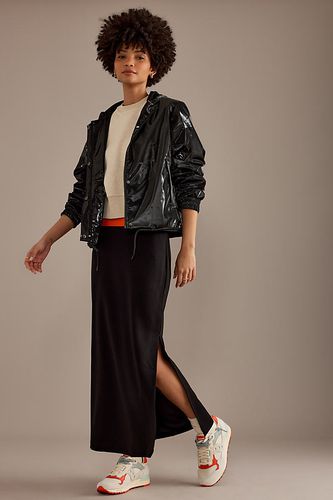 Veste à capuche légère imperméable ultra-brillante en Black, taille: XS chez Anthropologie - Rains - Modalova