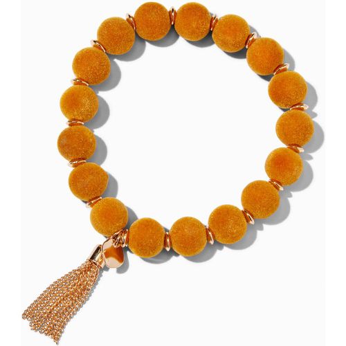 Bracelet élastique à pompon couleur dorée avec perles d’imitation moutarde - Claire's - Modalova