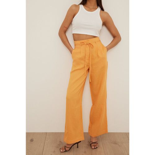 Pantalon en lin taille haute - Orange - NA-KD Trend - Modalova