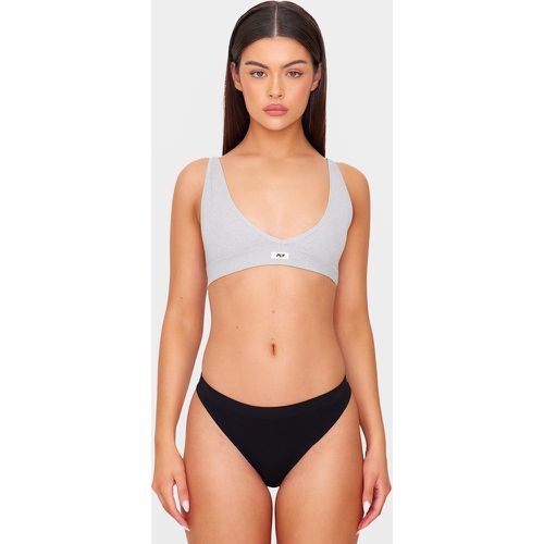 Soutien-gorge sans coutures à décolleté plongeant et badge - PrettyLittleThing - Modalova