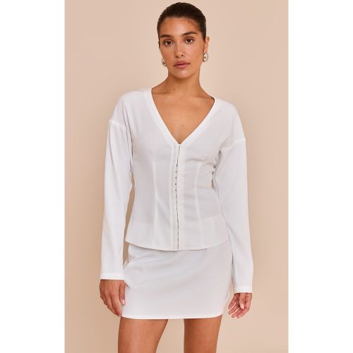 Petite Top long sans col à taille cintrée et agrafes et oeillets - PrettyLittleThing - Modalova
