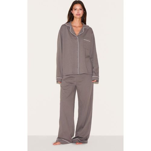 Ensemble de pyjama long à rayures et lisérés surjetées - PrettyLittleThing - Modalova