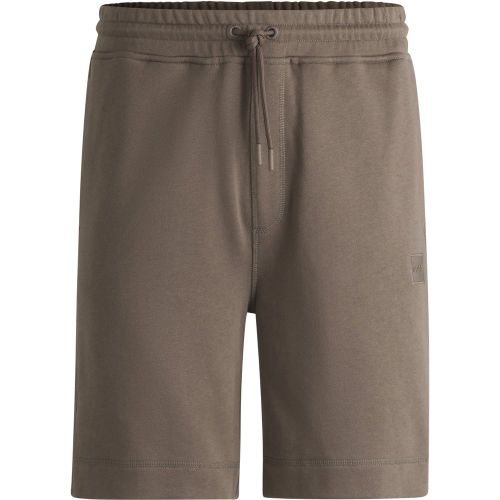 Short Relaxed en molleton de coton avec badge logoté - Boss - Modalova