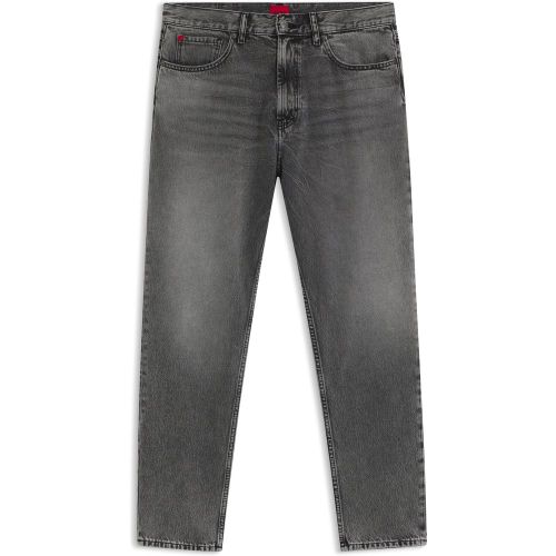 Jean Tapered en denim rigide à effets usés - HUGO - Modalova