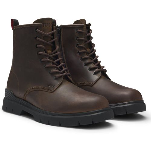 Bottines en cuir avec logo embossé - HUGO - Modalova
