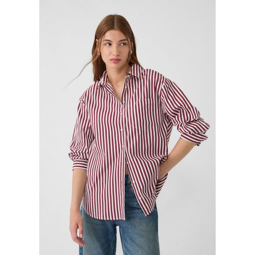 Chemise oversize avec poche en popeline à rayures XS - Stradivarius - Modalova