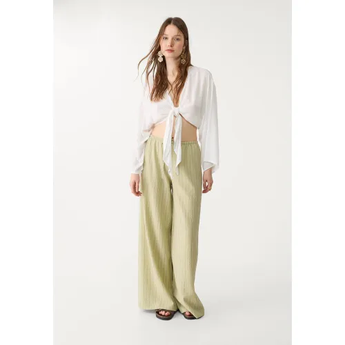 Blouse fluide à nœud XS - Stradivarius - Modalova