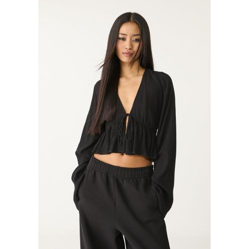 Chemisier à volants et à lacets XS - Stradivarius - Modalova