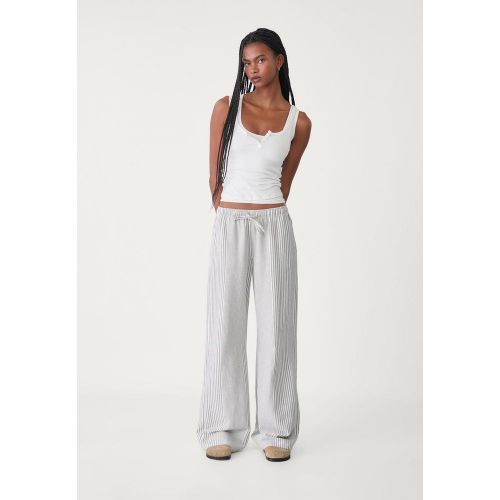 Pantalon fluide rayé en lin XS - Stradivarius - Modalova