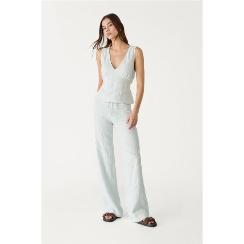 Pantalon straight brodé en lin 32 - Stradivarius - Modalova