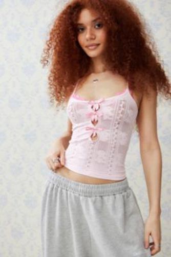 UO Lay Lace Bow Cami par en Rose taille: Large - Urban Outfitters - Modalova