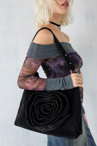 UO - Sac ample avec rosace en cuir suédé par en Noir - Urban Outfitters - Modalova