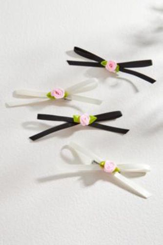 Barrettes à naud rosette Jemima - Lot de 4 par en Pink - Urban Outfitters - Modalova