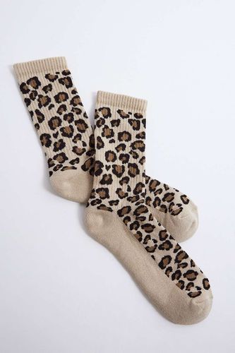 Chaussettes imprimé léopard par en taille: TAILLE UNIQUE - Urban Outfitters - Modalova