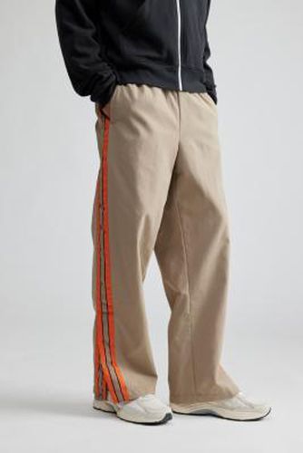 UO - Pantalon de survêtement baggy à rayures par taille: XS - Urban Outfitters - Modalova