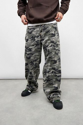Jean camouflage exclusif UO en taille: Medium - Ed Hardy - Modalova