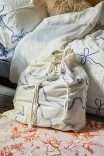 Sac à linge à cordon de serrage imprimé par en taille: TAILLE UNIQUE - Urban Outfitters - Modalova