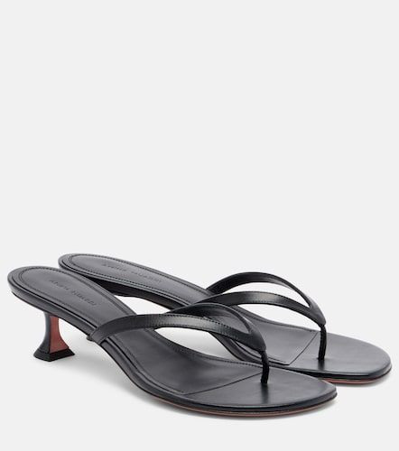 Amina Muaddi Mules Juliette en cuir - Amina Muaddi - Modalova