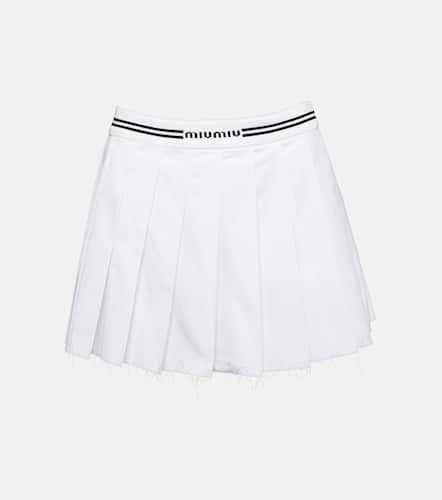 Miu Miu Mini-jupe en coton à logo - Miu Miu - Modalova
