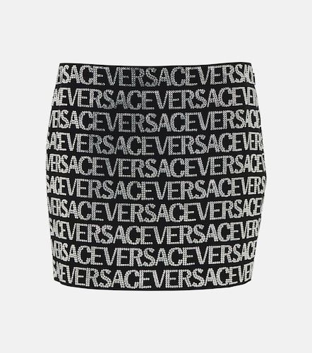 Versace Mini-jupe à ornements - Versace - Modalova