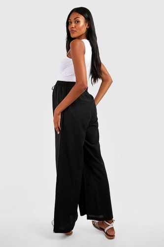 Pantalon de maternité en imitation lin avec cordon de serrage et jambes larges | Taille 44 - boohoo - Modalova