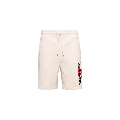 Short Short Dilson blanc cassé en molleton de coton - HUGO - Modalova