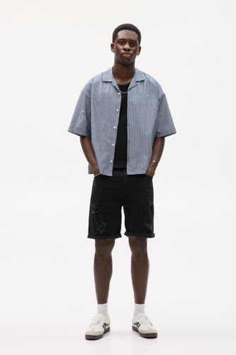 Bermuda En Jean Slim Déchirures - Pull&Bear - Modalova