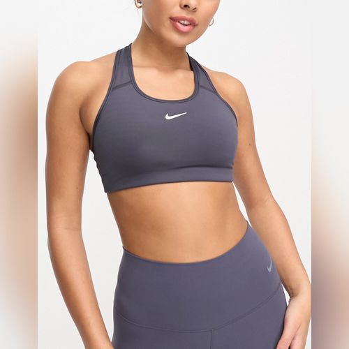 Nike Pro Training - Brassière de sport asymétrique maintien moyen en tissu  Dri-FIT avec logo virgule - Noir