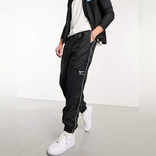 Nike - Pantalon de jogging à logo virgule - Prune